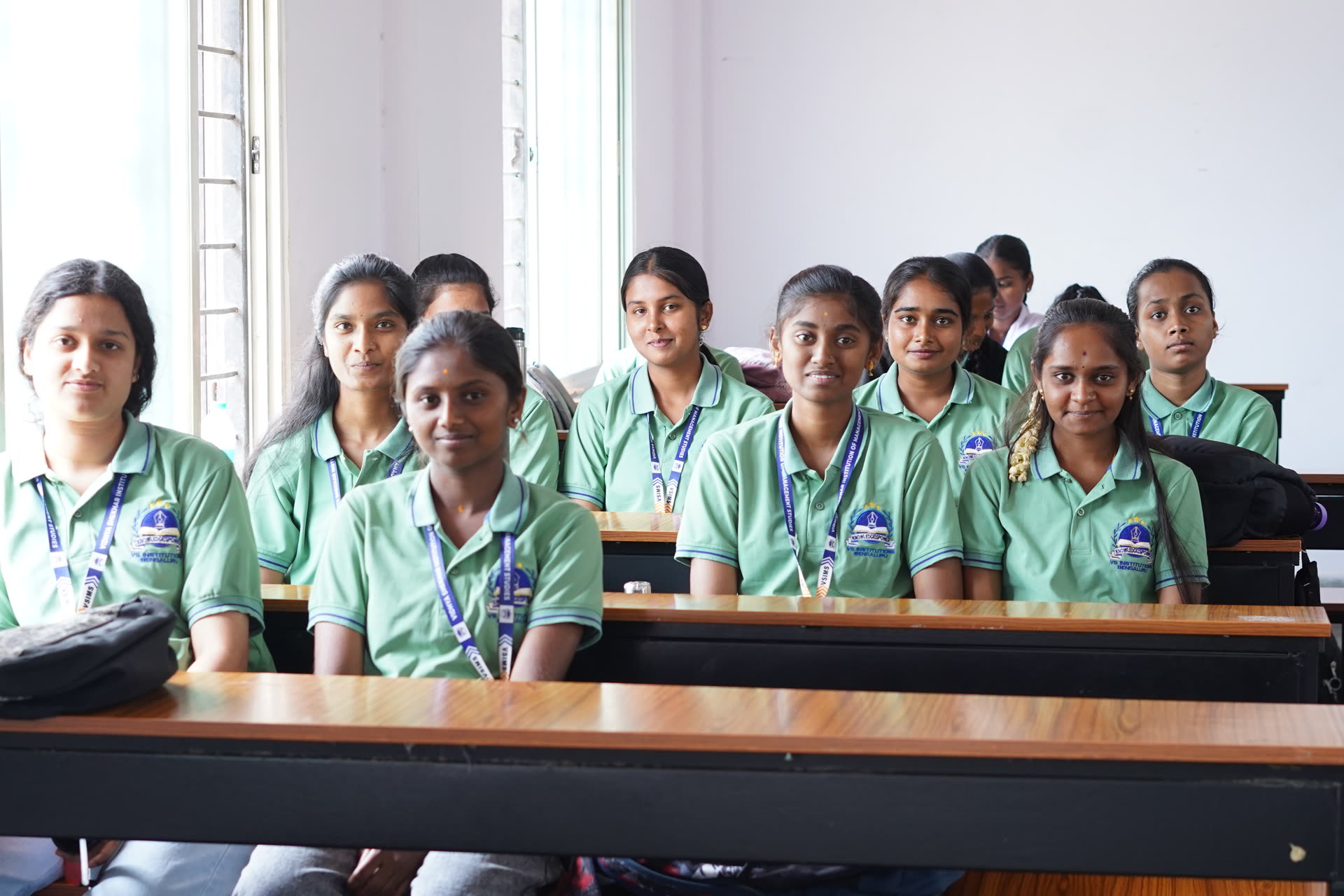 Group of students in green uniforms